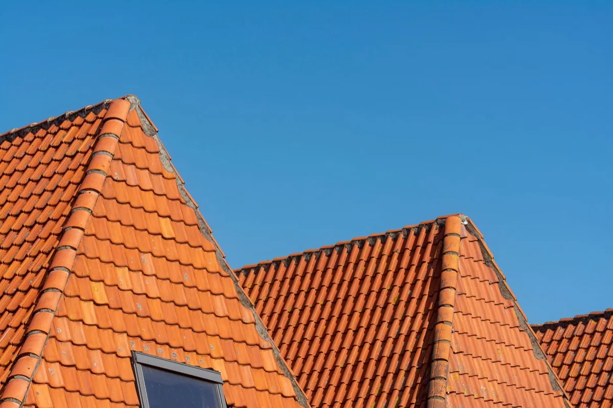 Clay barrel tile rooflines on homes in Clifton, NJ